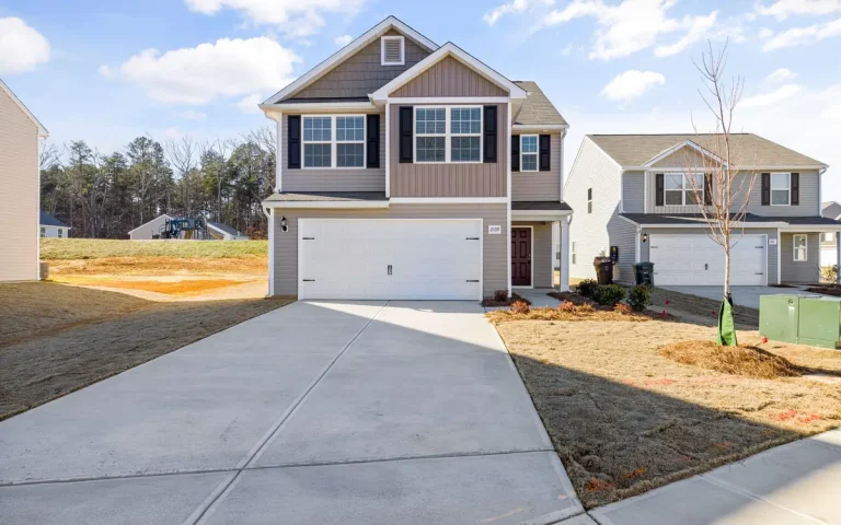New-construction home with a white garage door in La Vergne, TN