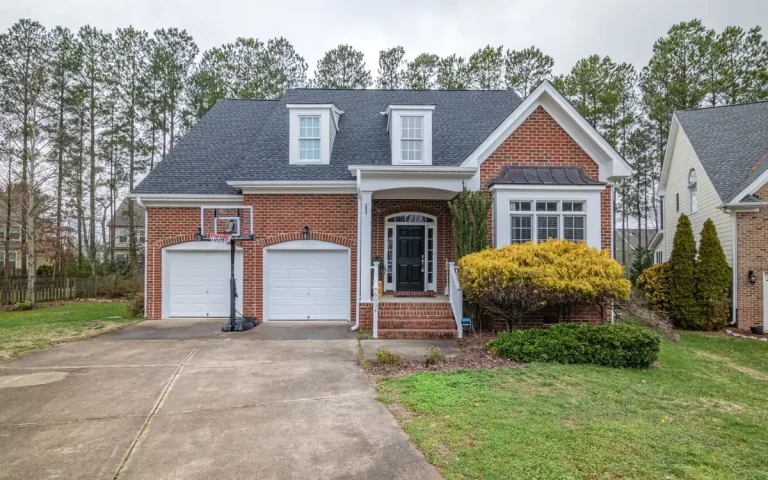 Brick home with two single garage doors in Walter Hill, TN